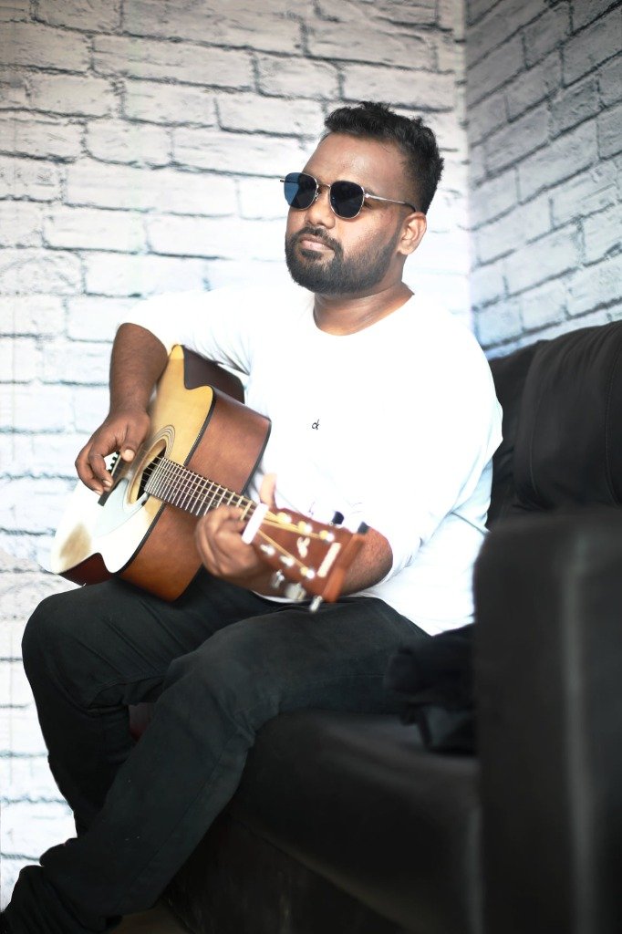 James playing guitar